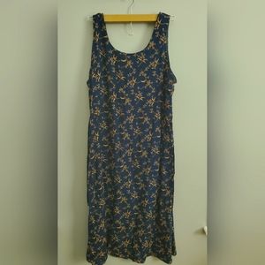 Navy blue dress with gold floral pattern. Size 16 with tie in the back